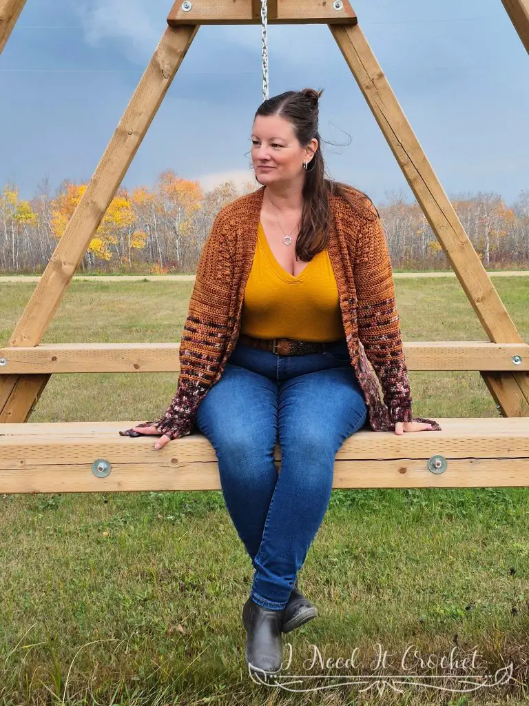 Boxed Baubles Cardigan free crochet cardigan pattern worn layered over a top