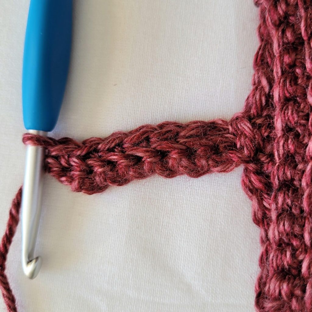 Working back loop only single crochet stitches for the sleeve trim ribbing