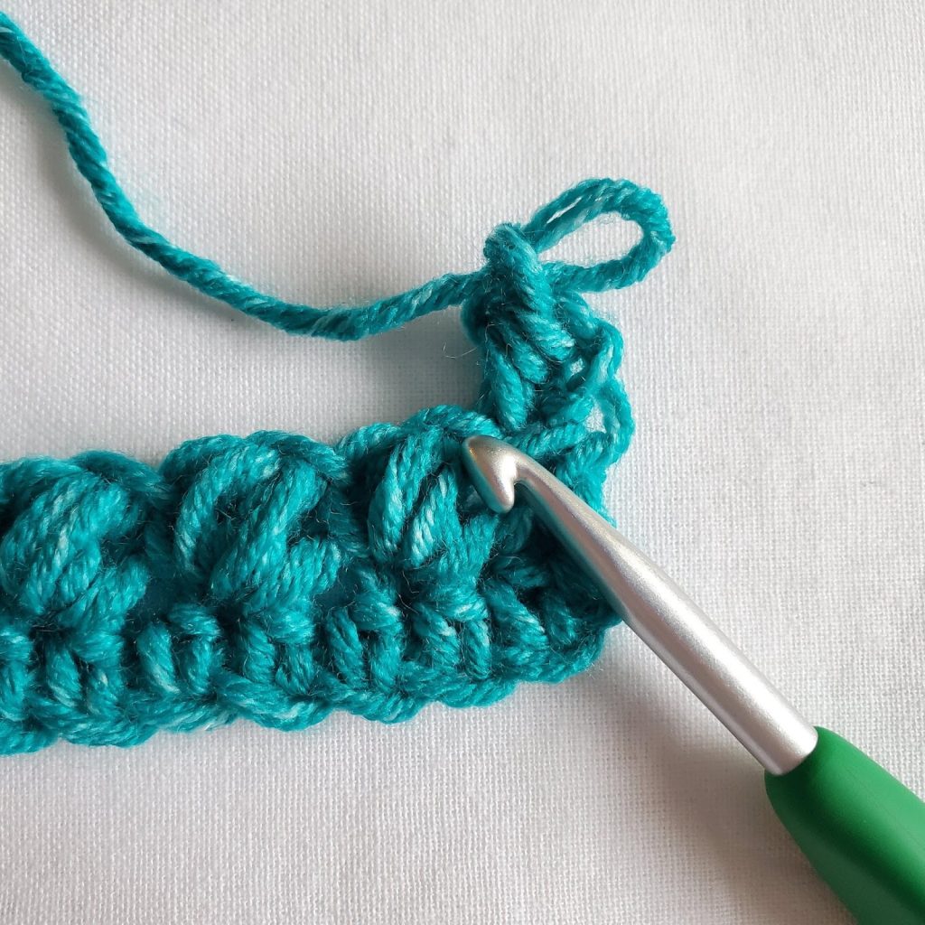Step 1 of row 2 of bean stitch crochet tutorial. 