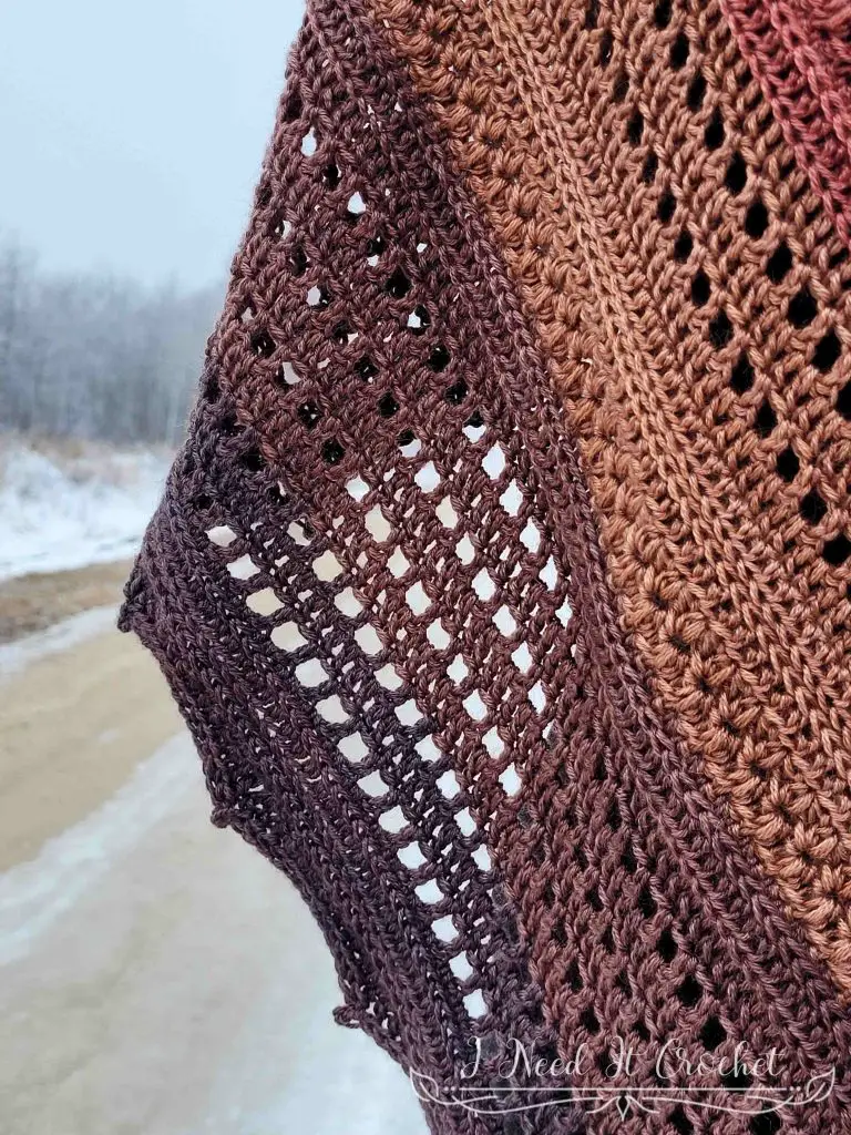 Stylized photo of the Free Crochet Shawl Pattern - Pinnacle Shawl.