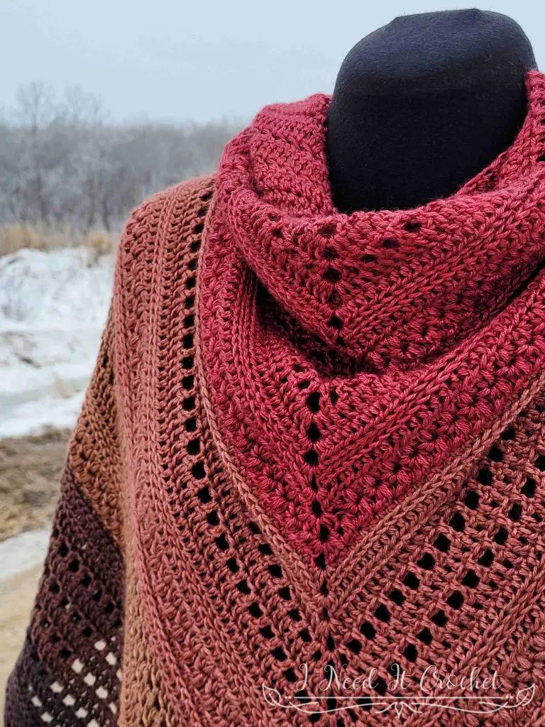 Stylized photo of the Free Crochet Shawl Pattern - Pinnacle Shawl. 