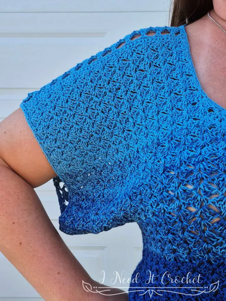 Free crochet top pattern – Slightly Slanted Blouse shown in gradient yarn with lace and solid panels.