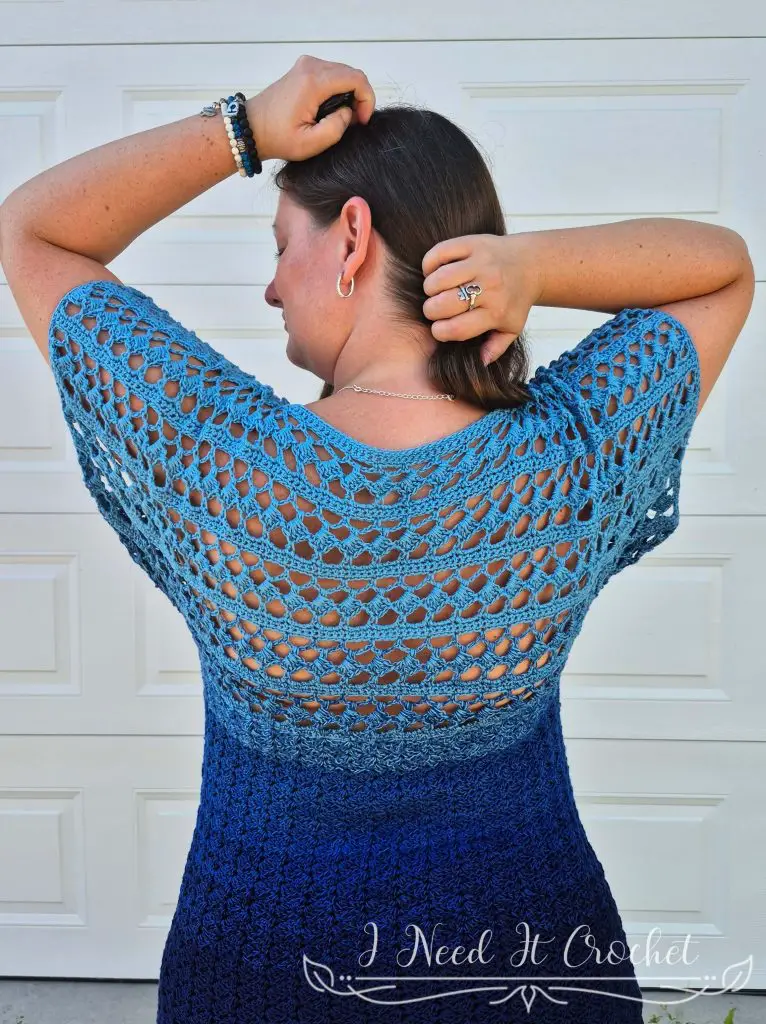 Free crochet top pattern – Slightly Slanted Blouse shown in gradient yarn with lace and solid panels.