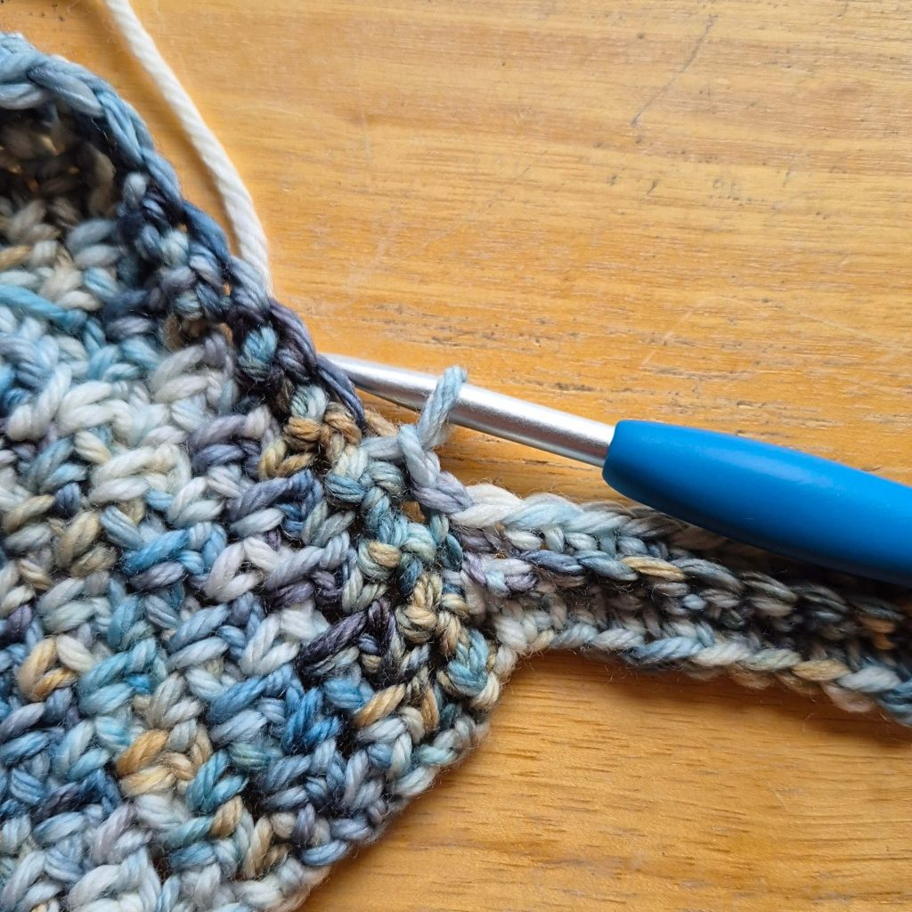 Close-up of textured crochet stitches used in the sweater scarf pattern