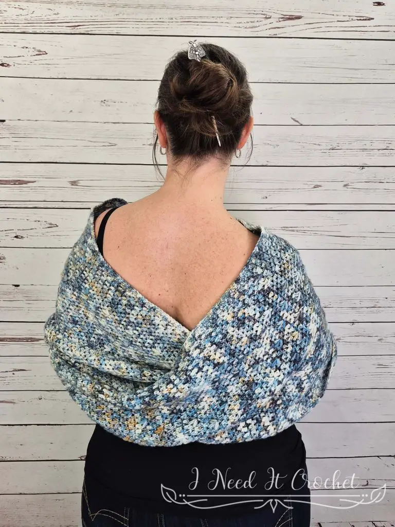 Handmade crochet sweater scarf worn casually, showing moss stitch and textured details