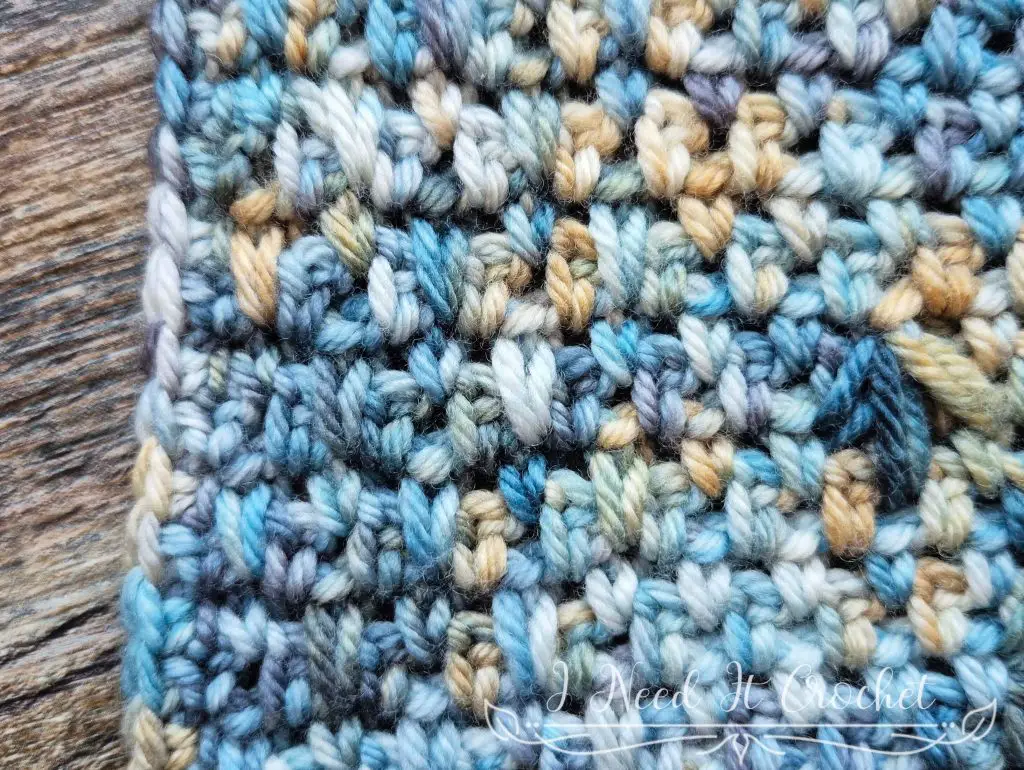 Textured crochet fabric showing the spiked single crochet stitch worked over moss stitch