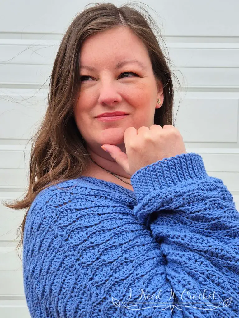 Close-up image of model wearing the Free Crochet Sweater Pattern: The Dulcis Pullover.