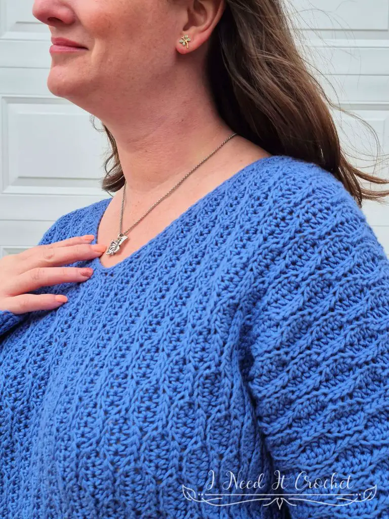 Close-up image of model wearing the Free Crochet Sweater Pattern: The Dulcis Pullover.