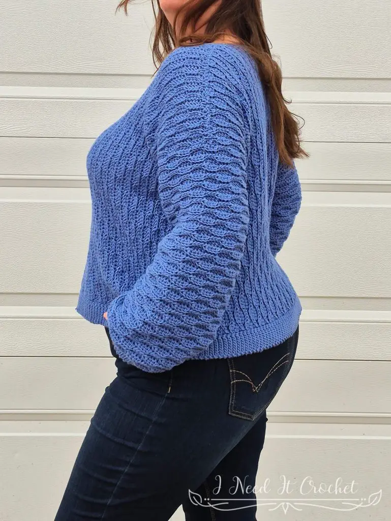 Close-up image of model wearing the Free Crochet Sweater Pattern: The Dulcis Pullover.